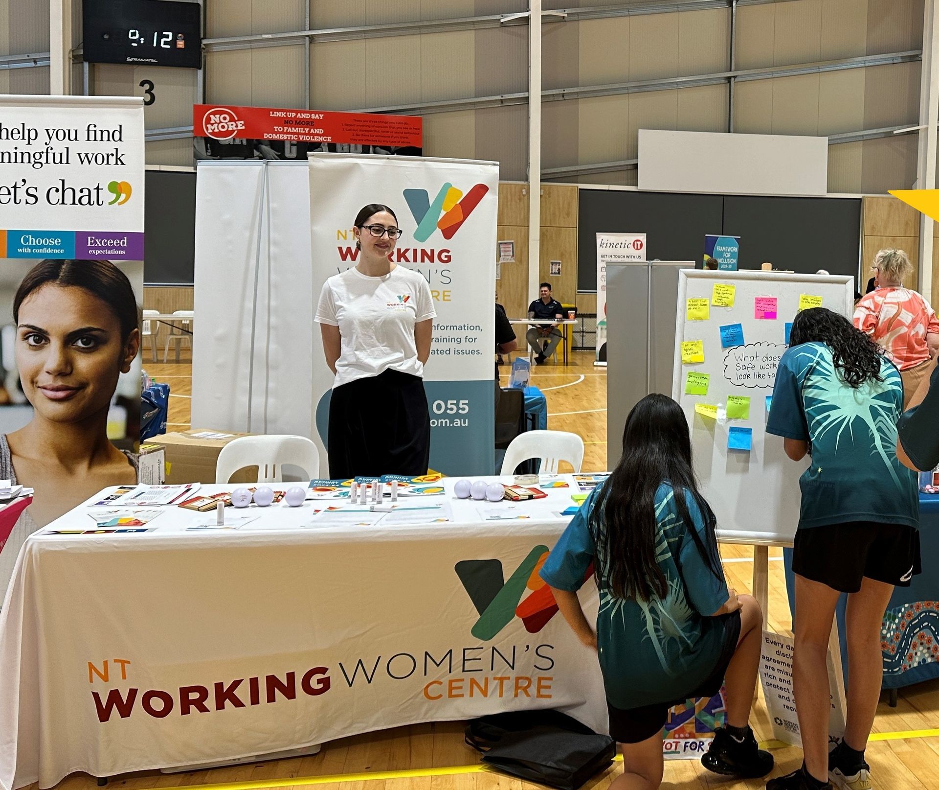 Jess with students engaging at stall at Darwin Youth Expo