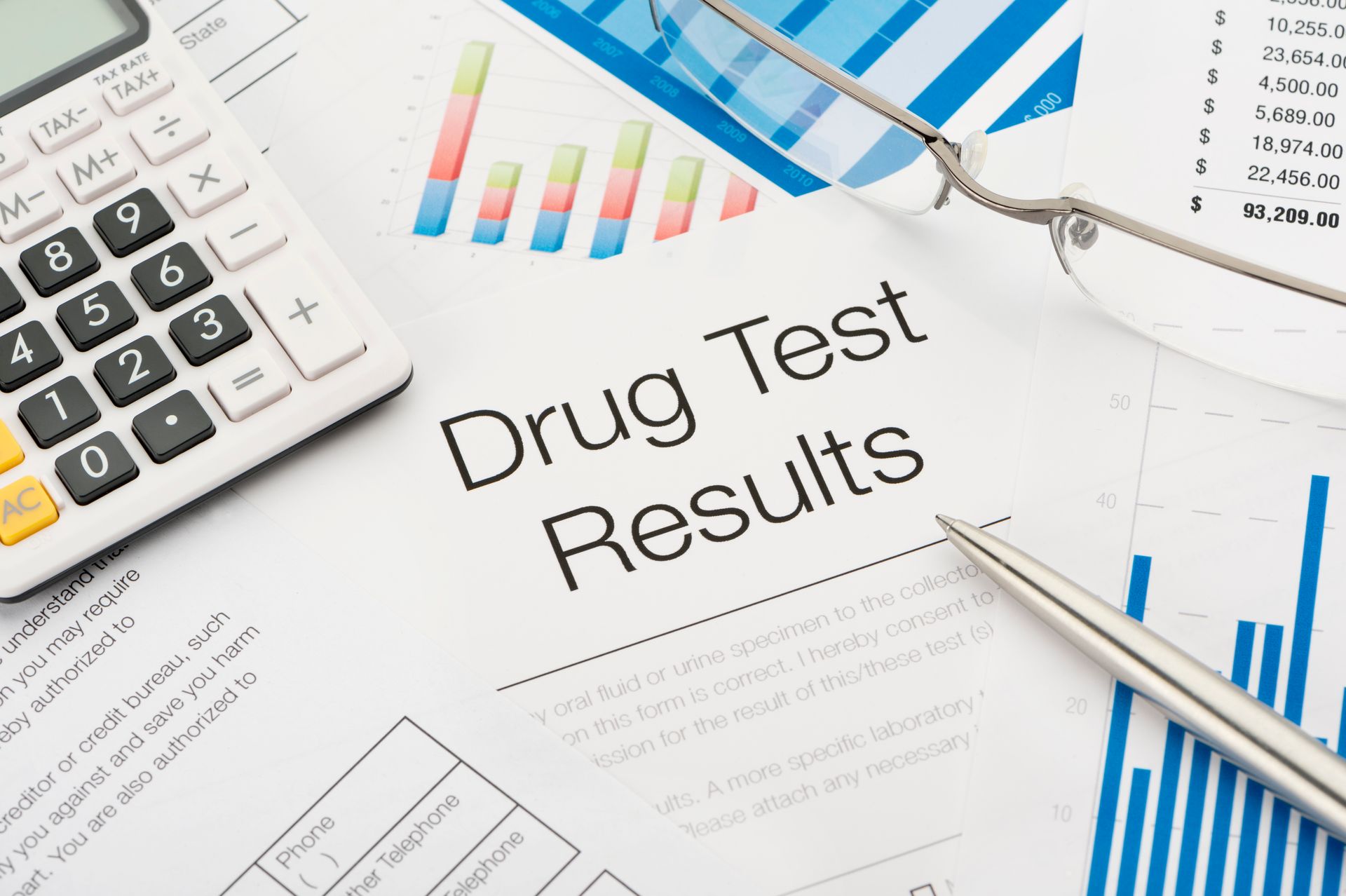Document titled Drug Test Results showcasing instant drug screening, calculator, pen, glasses.