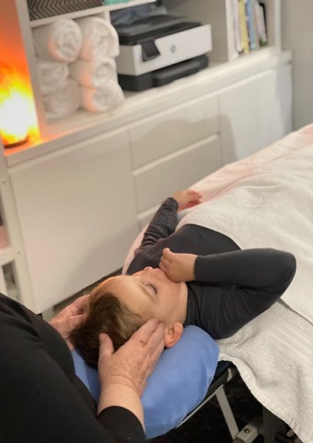 A Child Is Sleeping While In Therapy — Life24 Health Bowen Therapy In Lavington, NSW