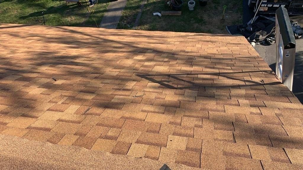A close up of a roof with shingles on it.