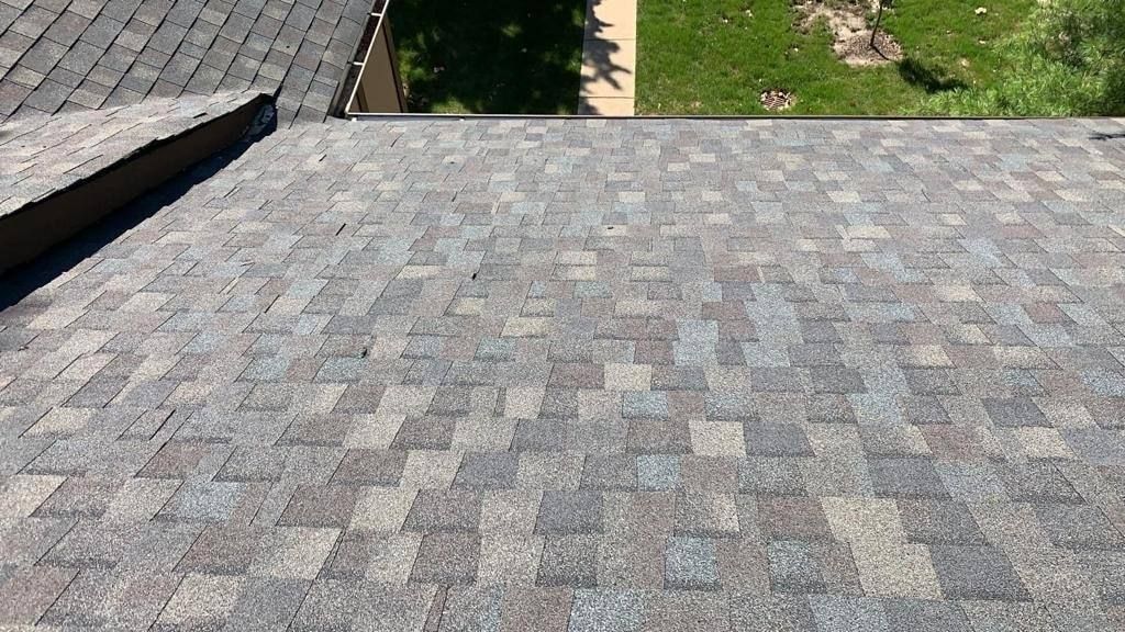 A close up of a roof with shingles on it.