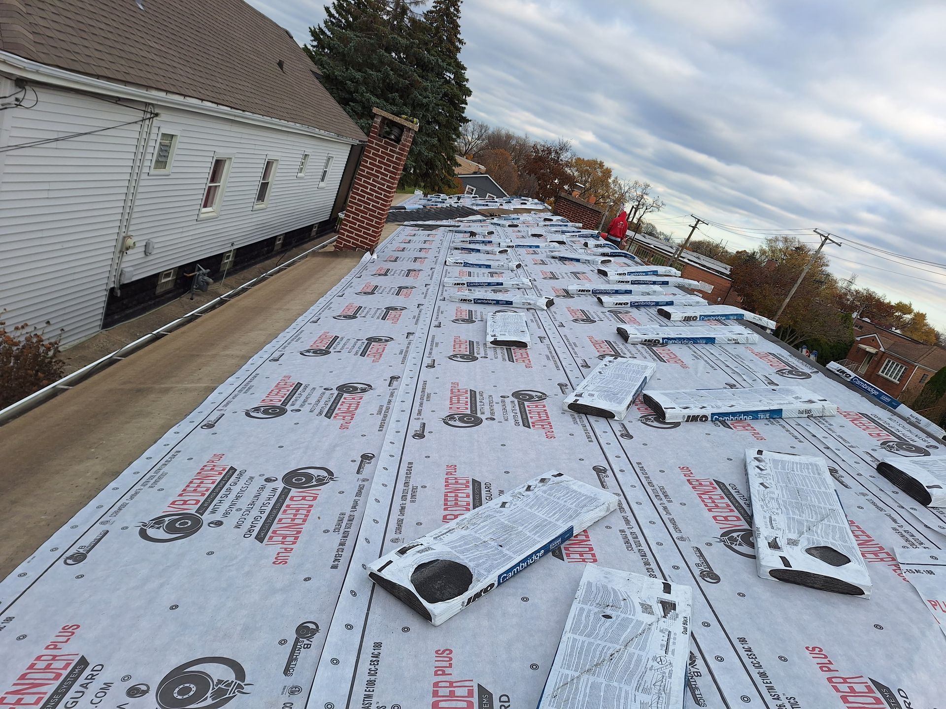 A roof with a lot of roofing material on it