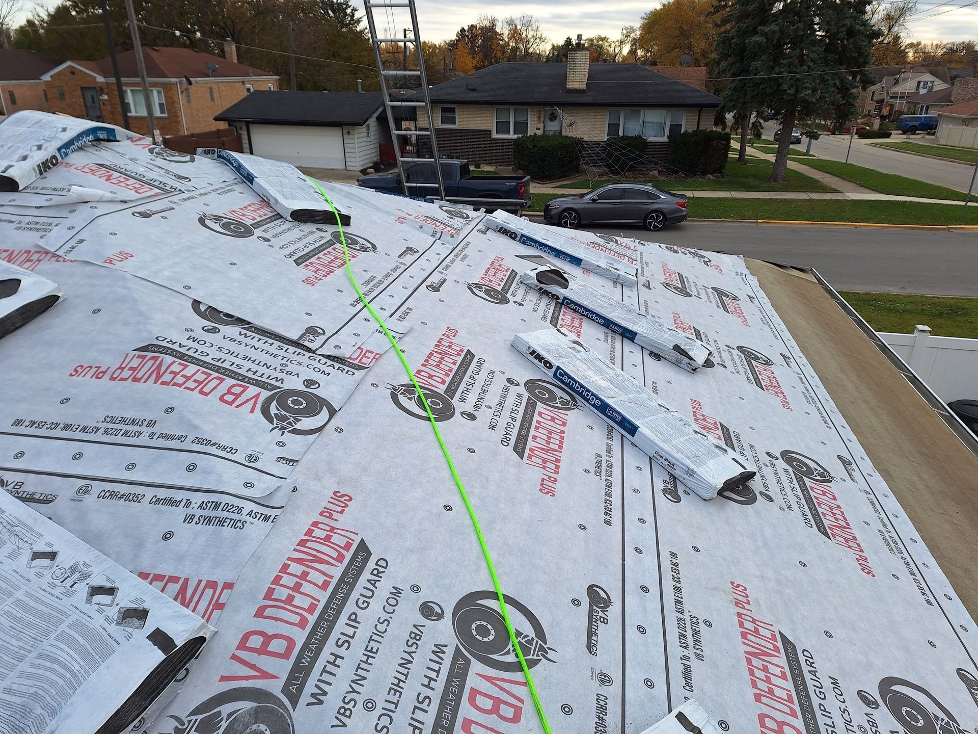 A roof is being covered with vb roofing paper