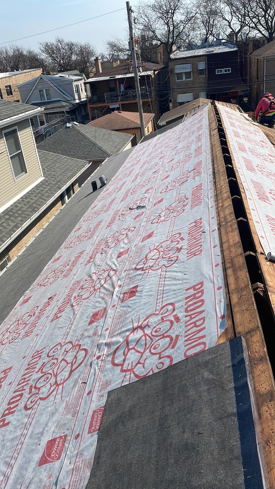 A roof with a lot of roofing material on it.