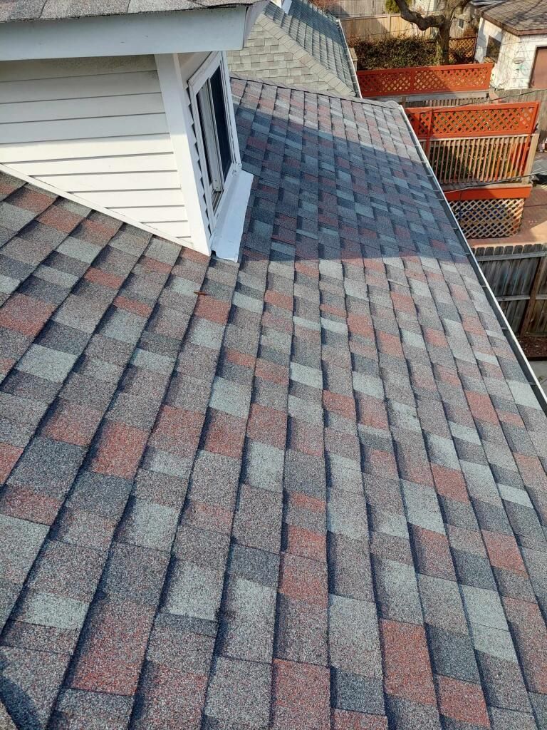 A close up of a roof with shingles on it.
