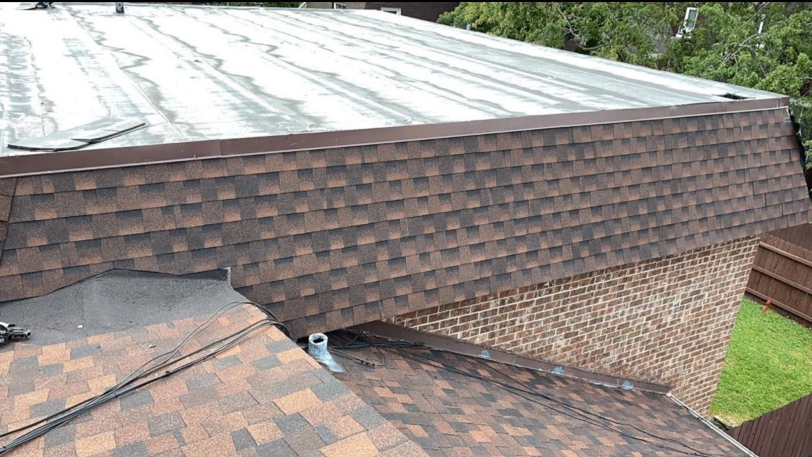 A close up of a roof with shingles on it.