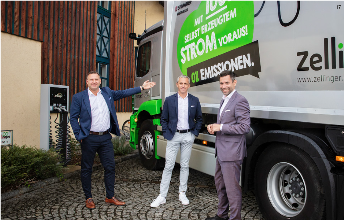 Drei Männer stehen vor einem Lastwagen