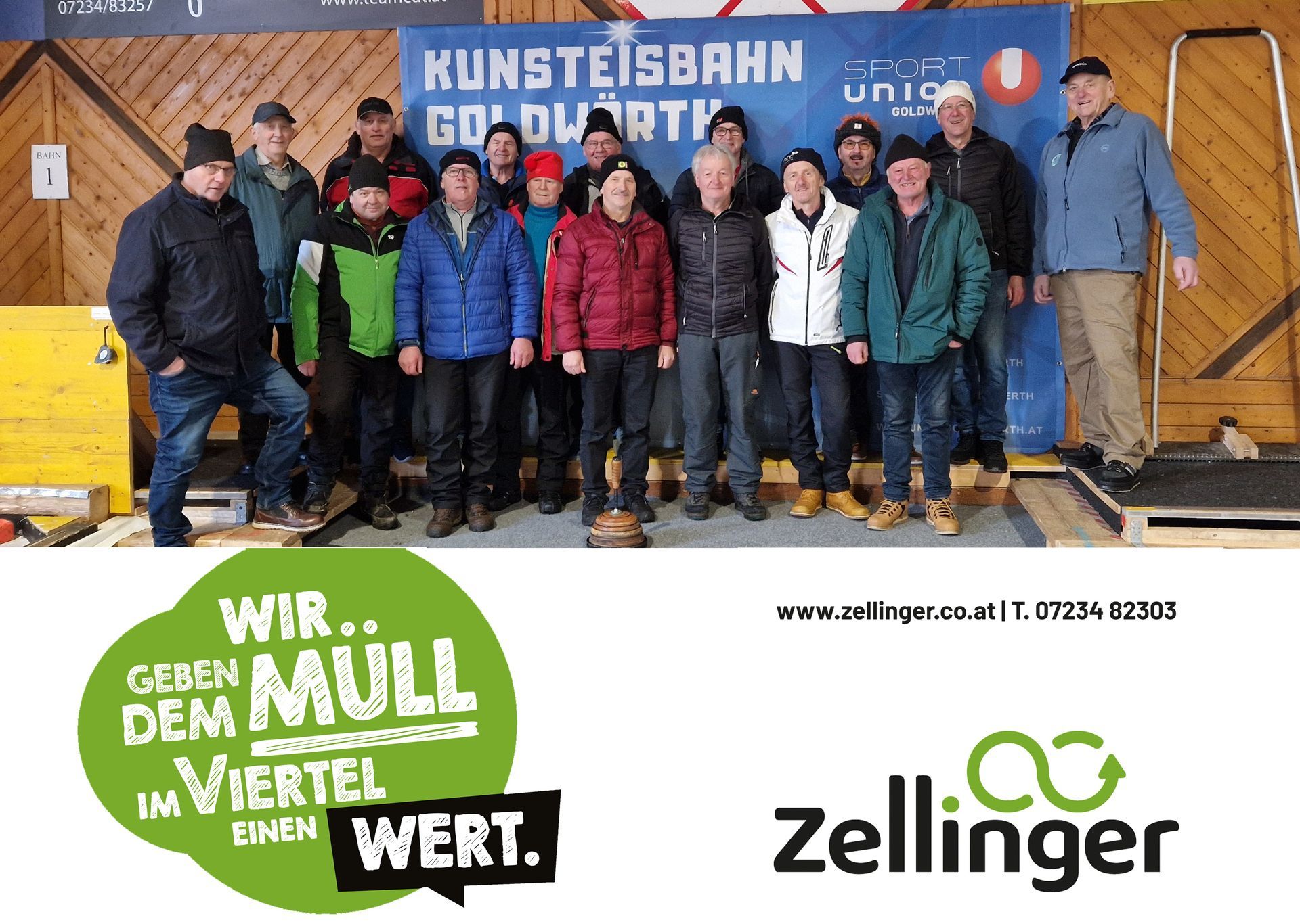 Group of people posing in front of a sign that reads