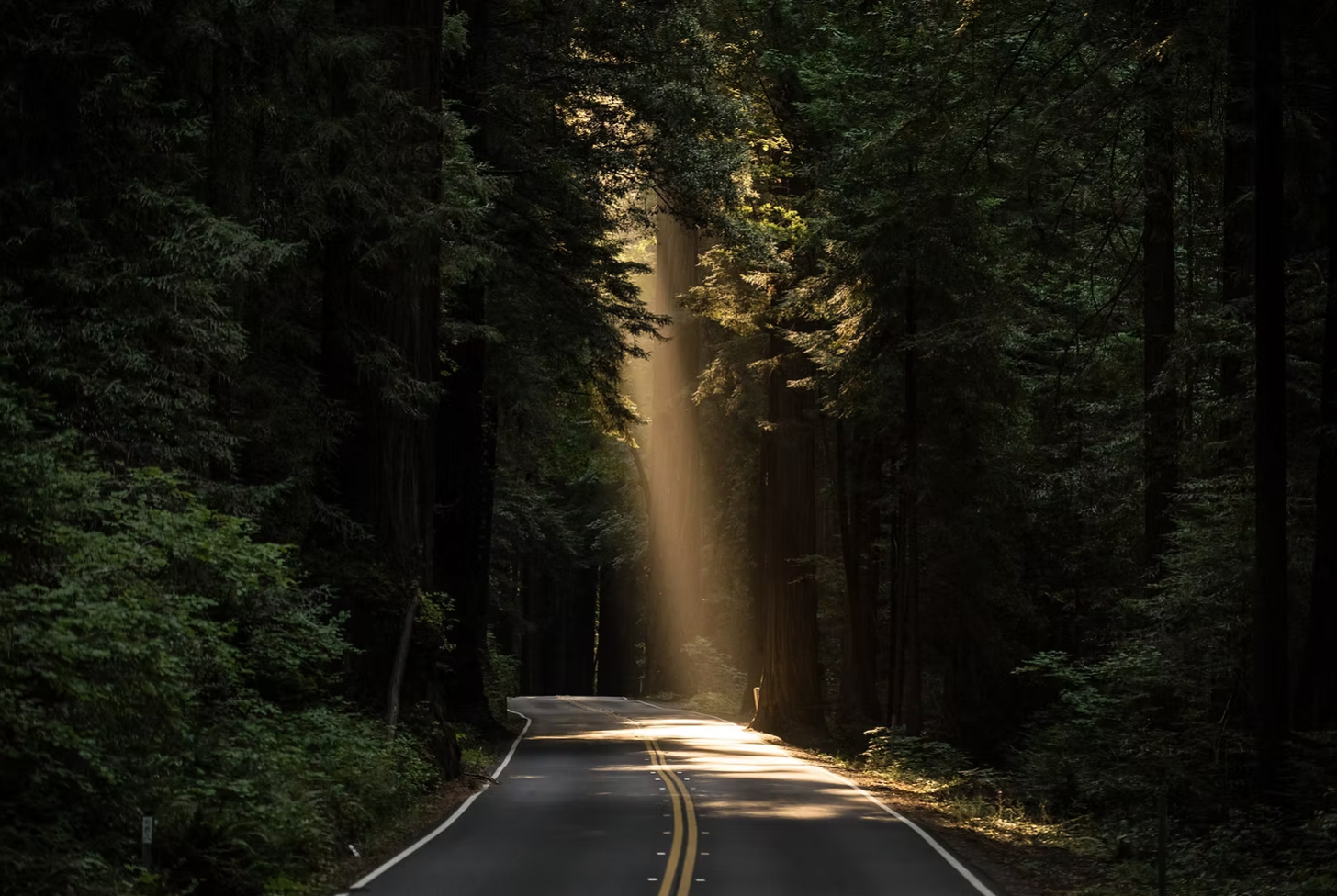 Mountain road with sunbeam