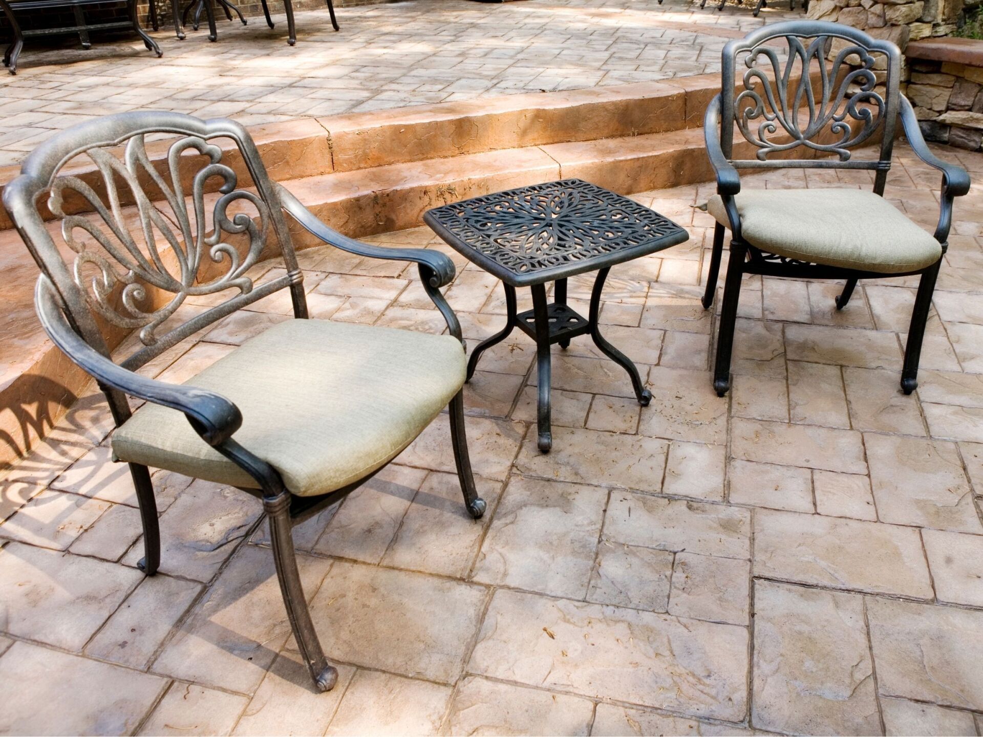 stamped concrete patio in Ottawa with chairs and table