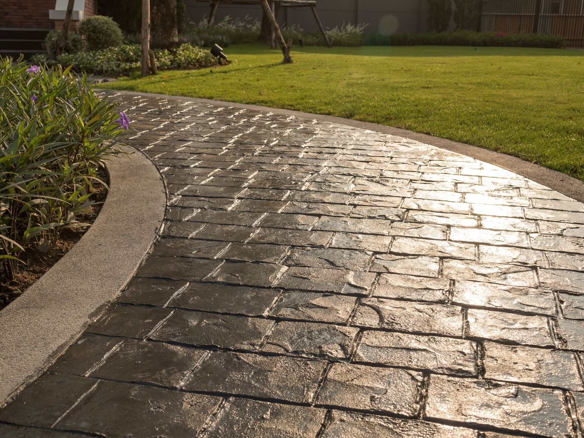 resurfaced concrete walkway near the lawn