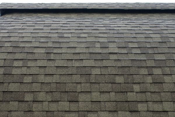 Gray shingled roof with a ridge line at the top
