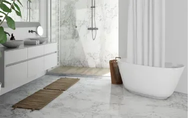 Modern white bathroom with freestanding tub, walk-in shower, vanity, and woven rug