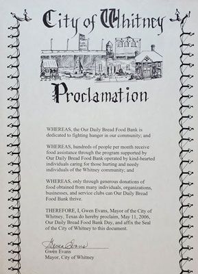 A city of whitney proclamation with a picture of a building on it.