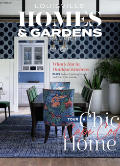 Cover of Louisville Homes & Gardens magazine featuring a dining room with blue patterned wallpaper and a dining set.