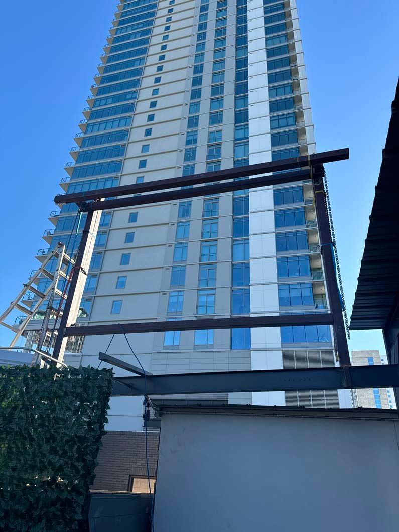 A tall building with a wooden railing in front of it