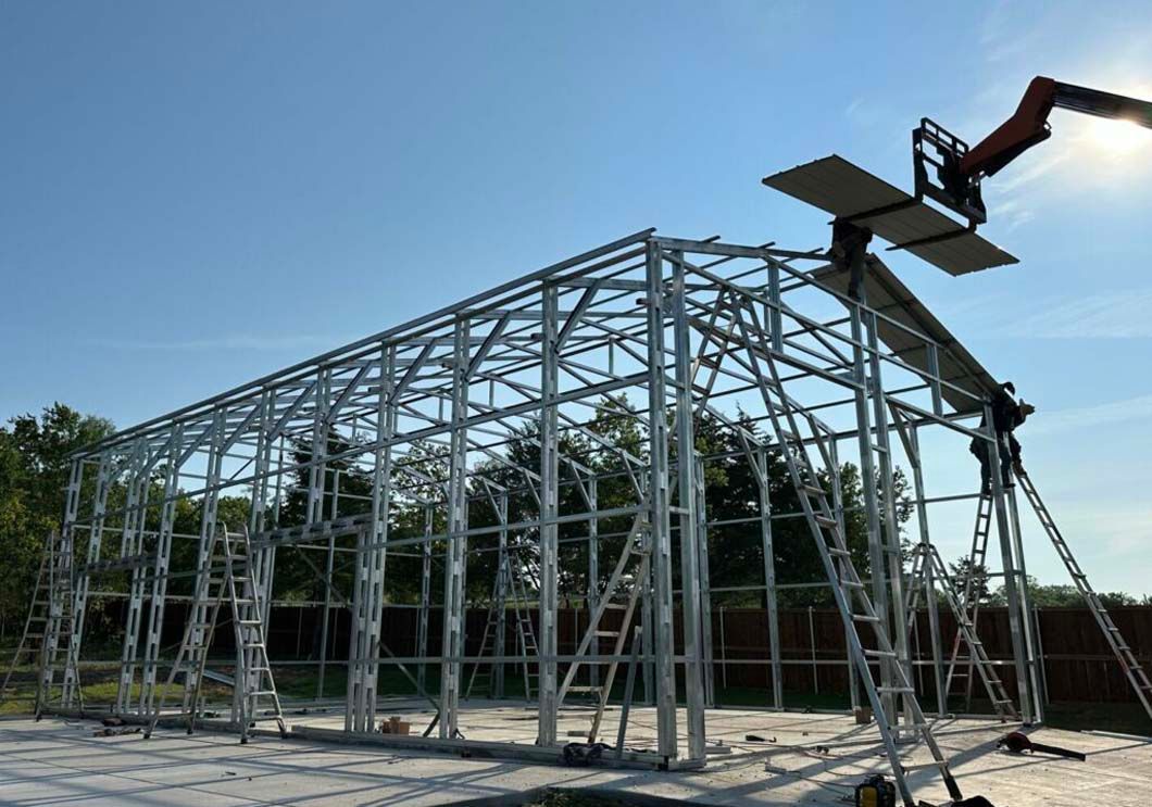 A large metal structure is being built with a crane.