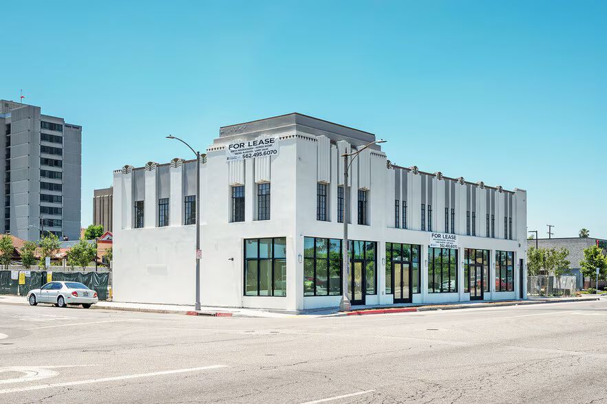 Modern industrial building with gray and white facade; 