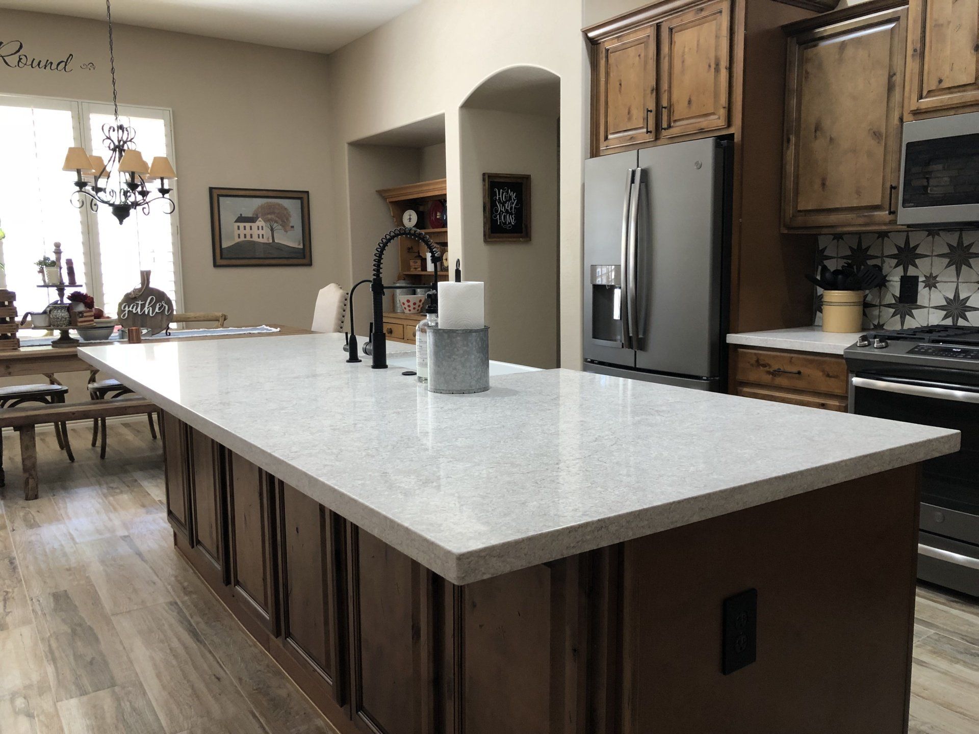There is a large island in the middle of the kitchen.