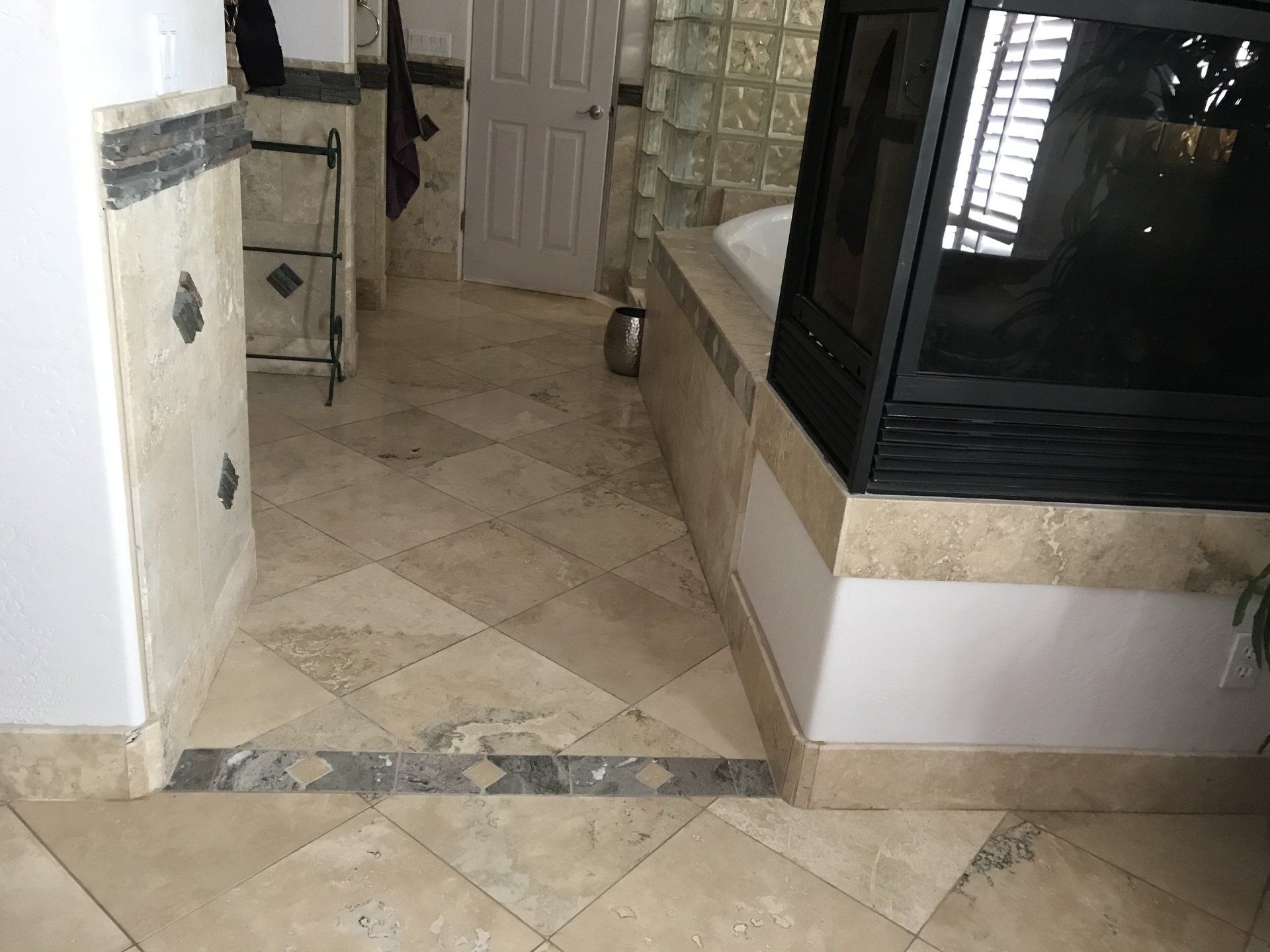 A bathroom with a fireplace and a bathtub