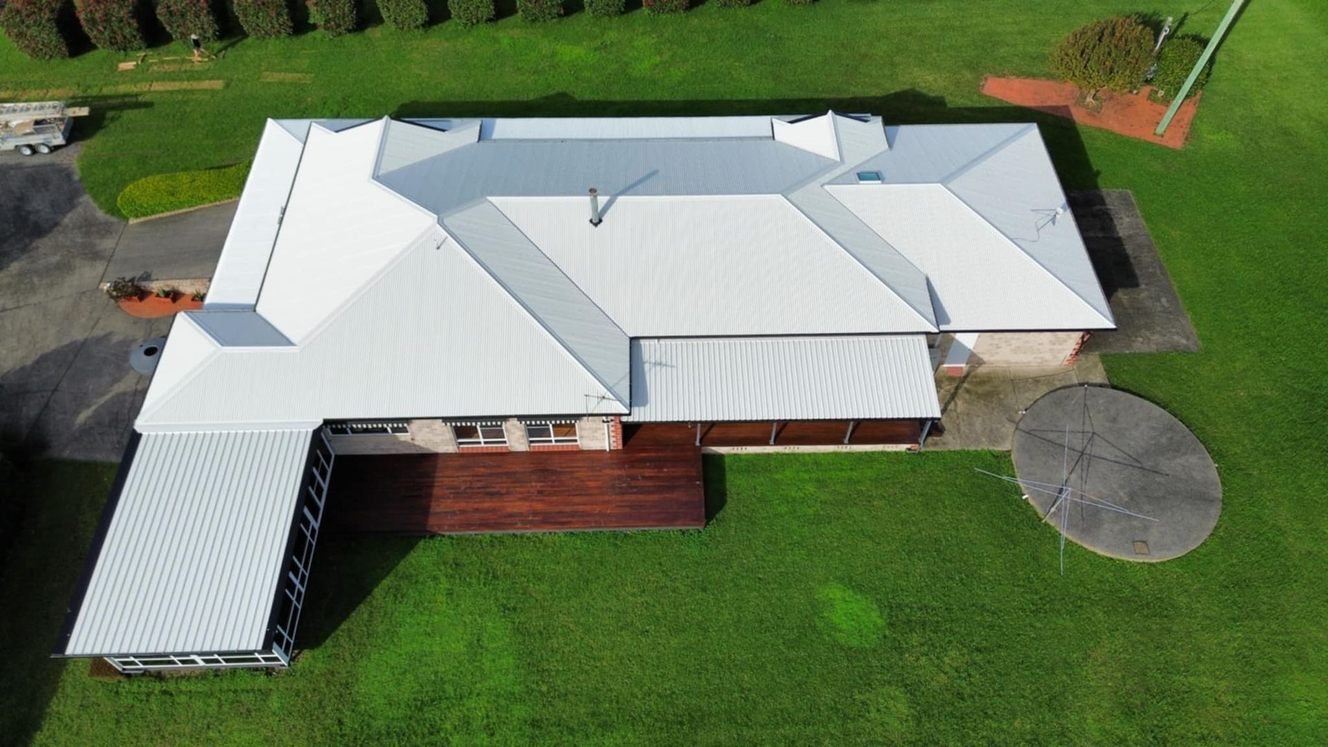 An Aerial View of a Large House With a Pool in the Backyard — Tim Leach Metal Roofing in Wauchope, NSW
