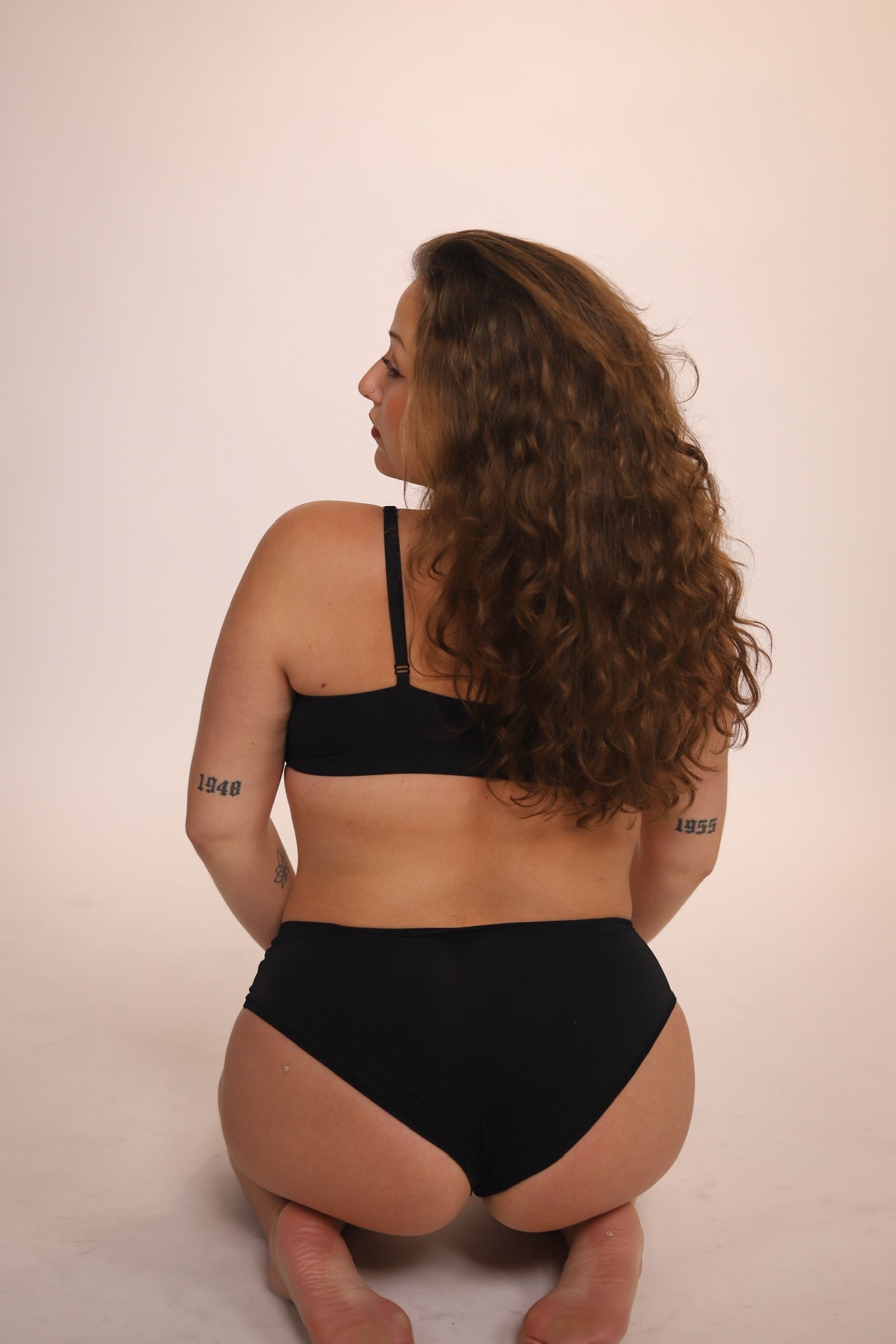 Close-up of a person with closed eyes, dewy skin, and neutral expression.