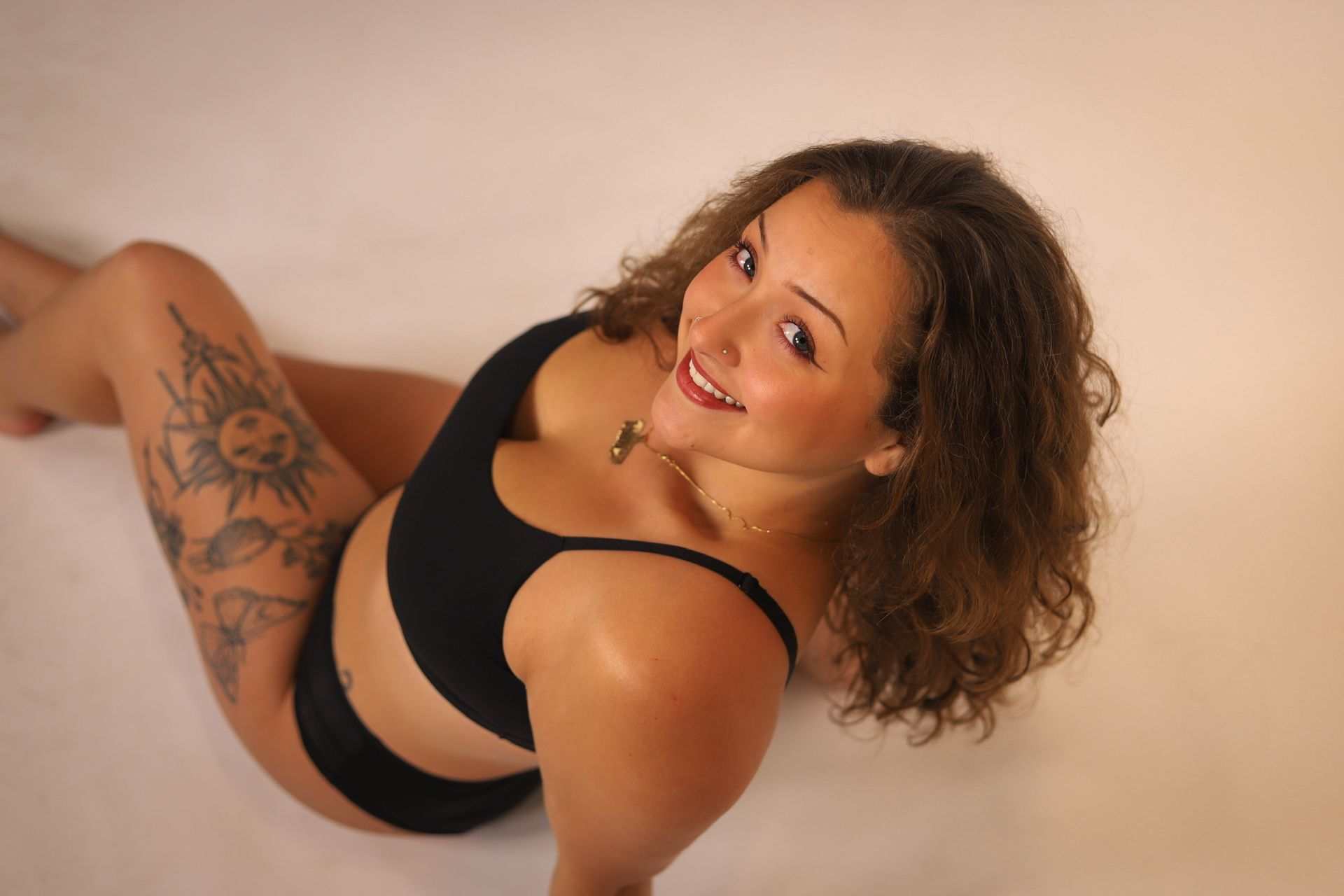 Close-up of a person with closed eyes, dewy skin, and neutral expression.