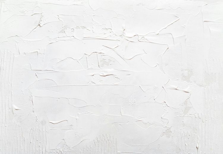 White textured surface with visible brushstrokes and uneven texture.