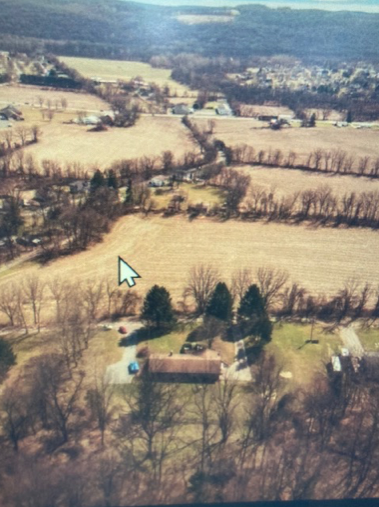 A drawing of a box next to a computer screen