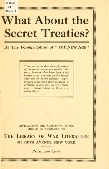 An aerial view of a shaded tunnel entry in the woods.