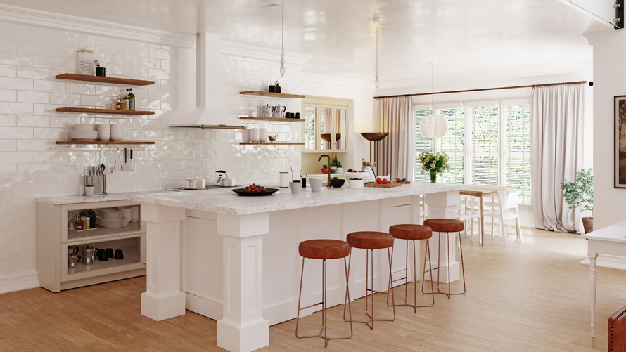 A kitchen with a large island and stools in it.
