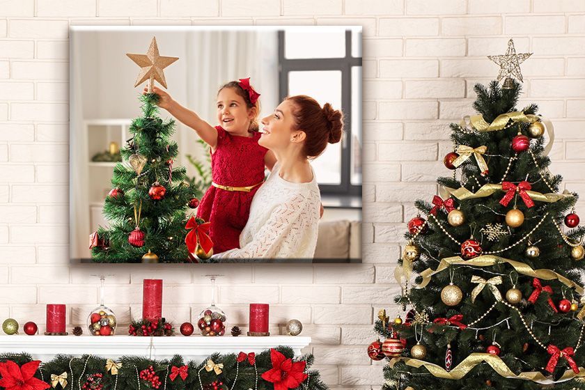 there is a picture of a family walking through a christmas tree farm .