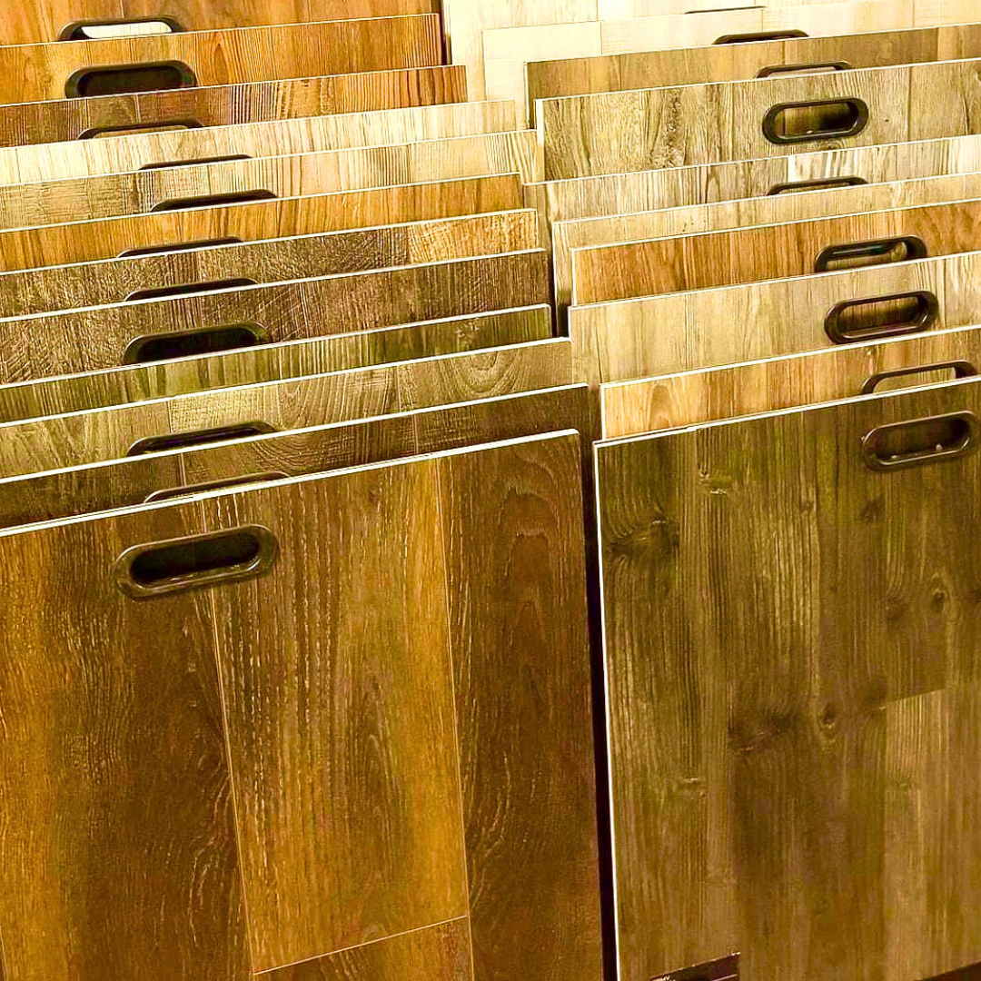 Samples of various wood flooring options, arranged in rows with handle cutouts.