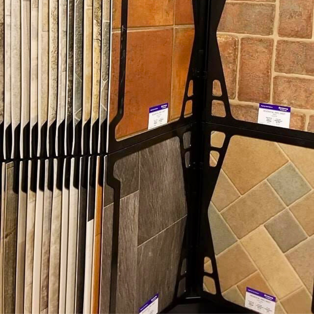 Tile samples arranged on a display stand, showcasing various colors and textures.