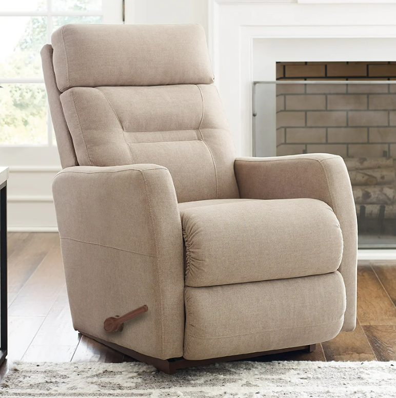 Beige recliner chair with wooden handle and base, in a living room setting.