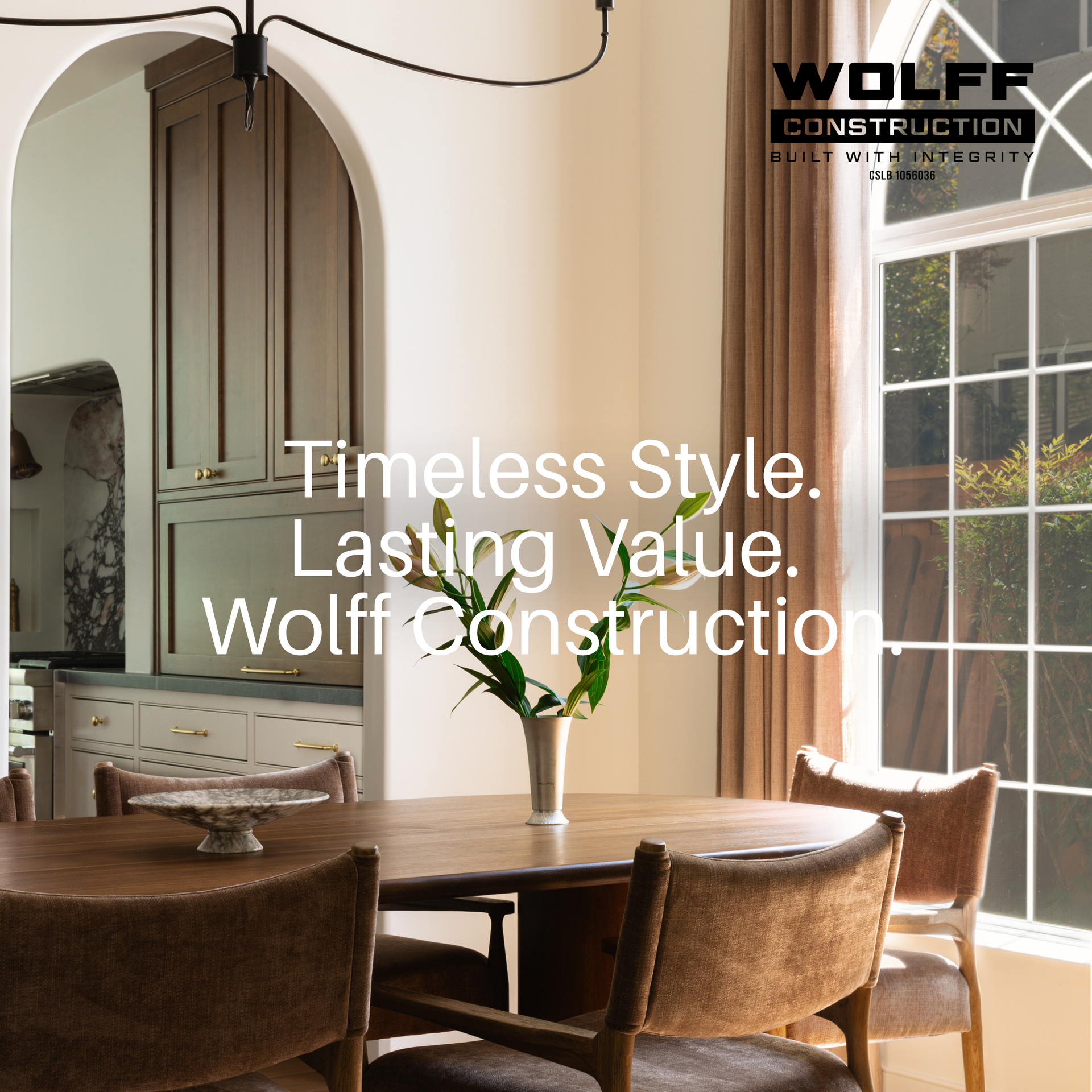 Luxury home remodel dining room with arched cabinets, warm wood furniture, and a large window.