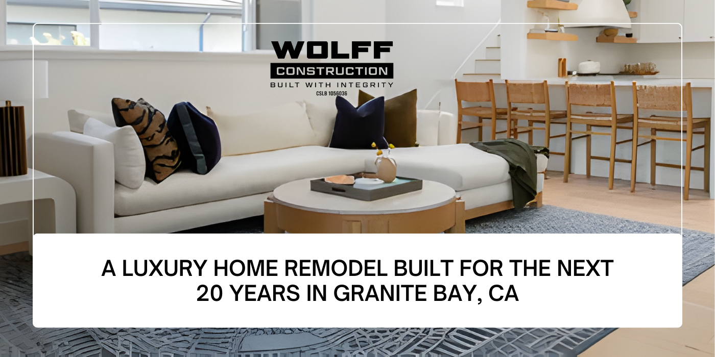 Interior of a remodeled home in Granite Bay, CA, with a white sectional sofa, pillows, and a wooden coffee table.
