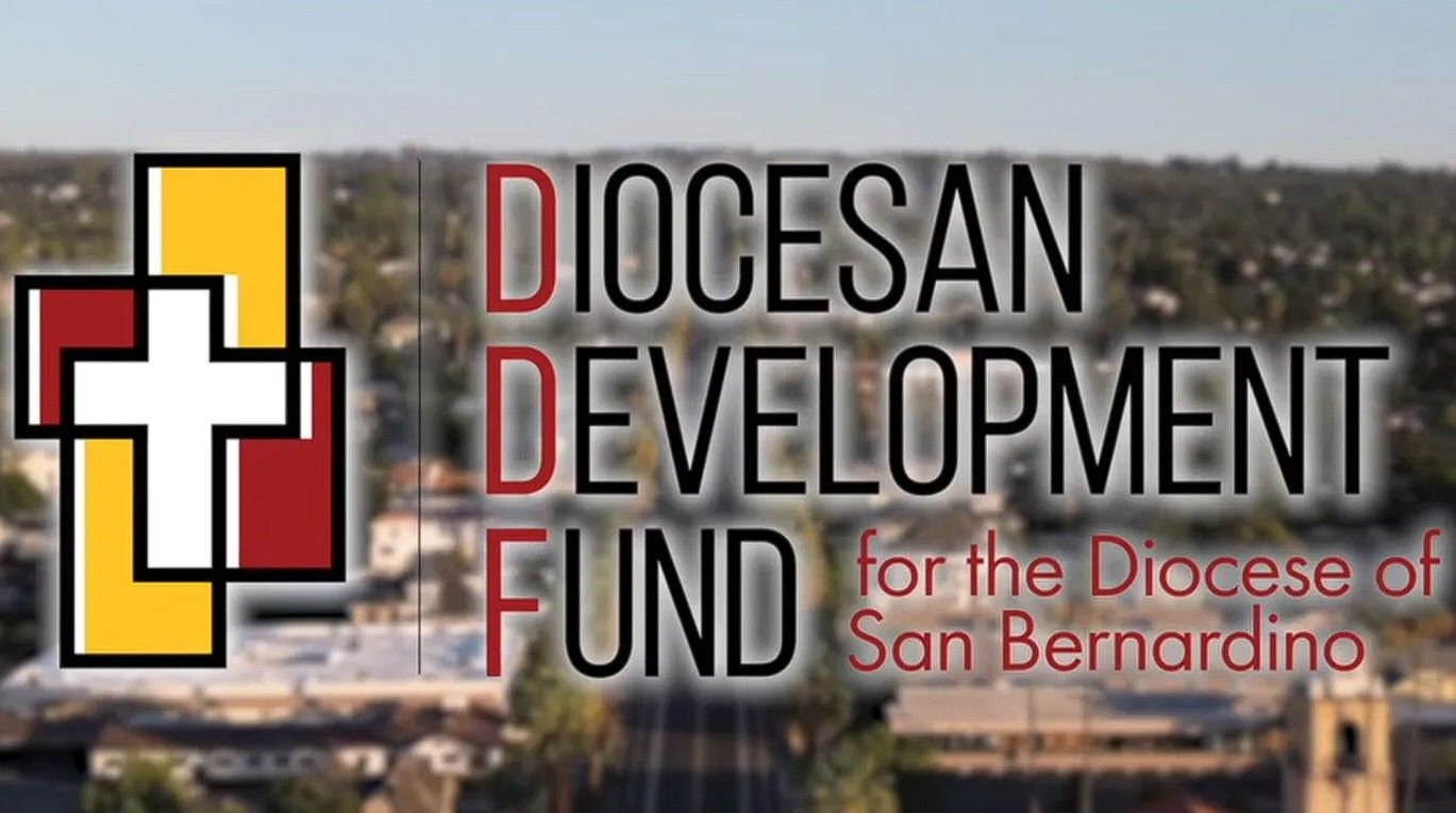 Logo for the Diocesan Development Fund, San Bernardino. A cross with a building backdrop, and text in red.