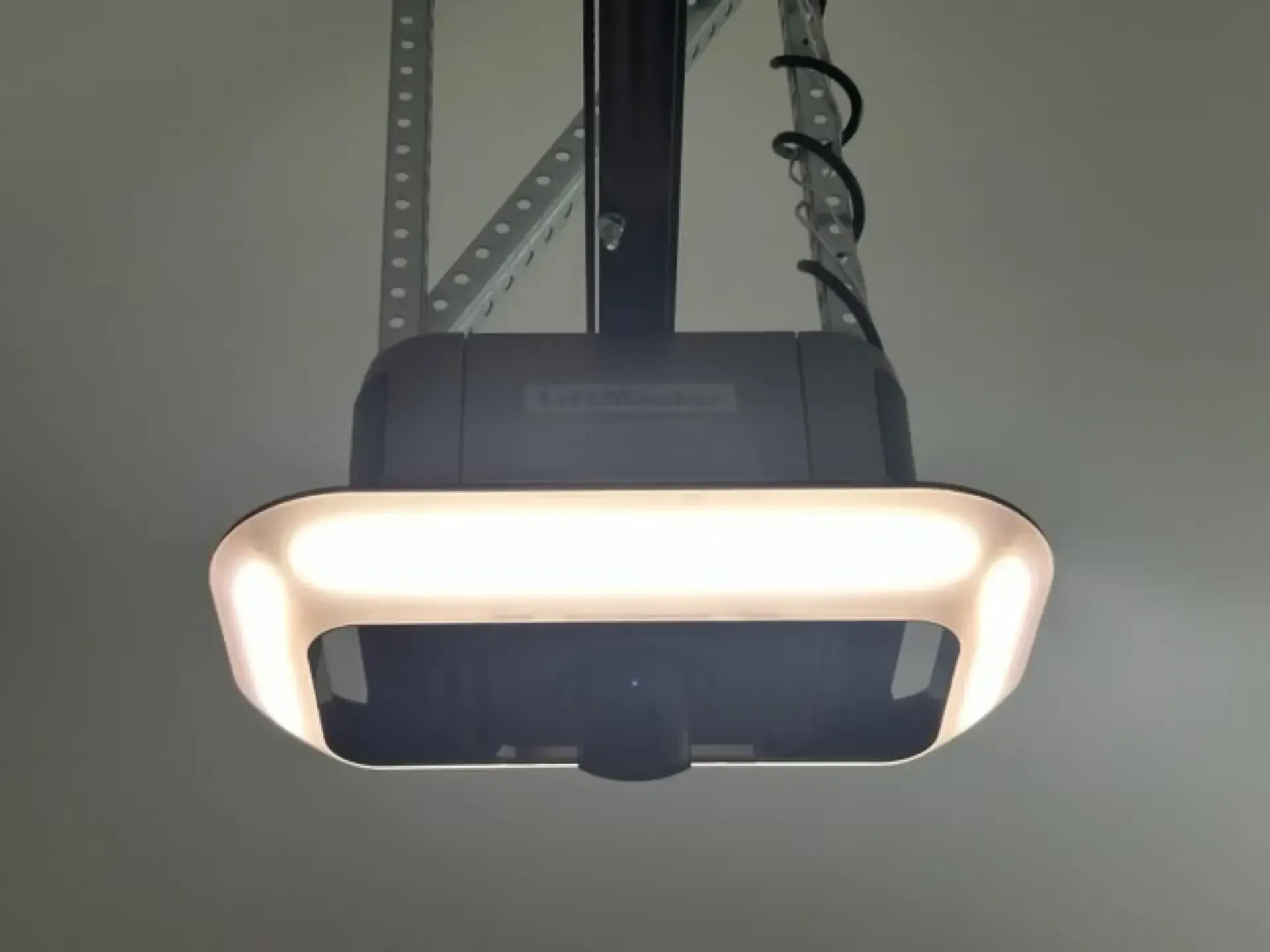 A garage door opener with a light attached to it