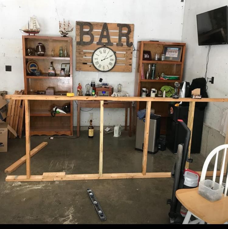 A room with a clock and a sign that says bar