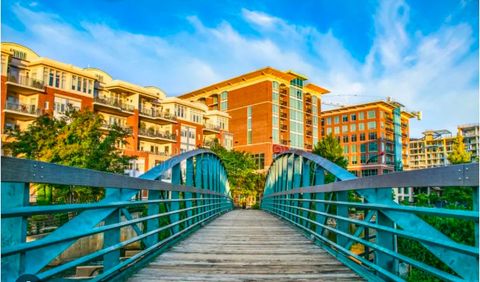 There is a bridge leading to a building in the background.