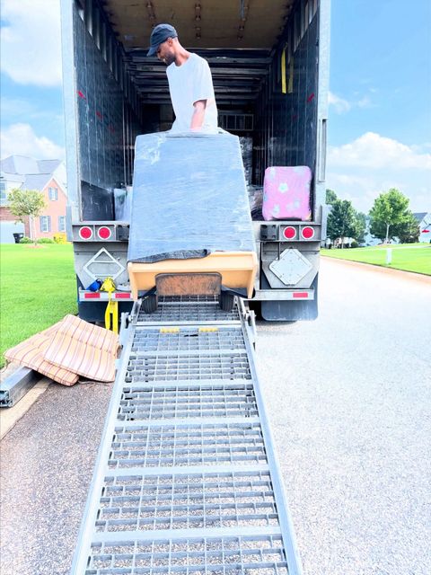 There is a bridge leading to a building in the background.