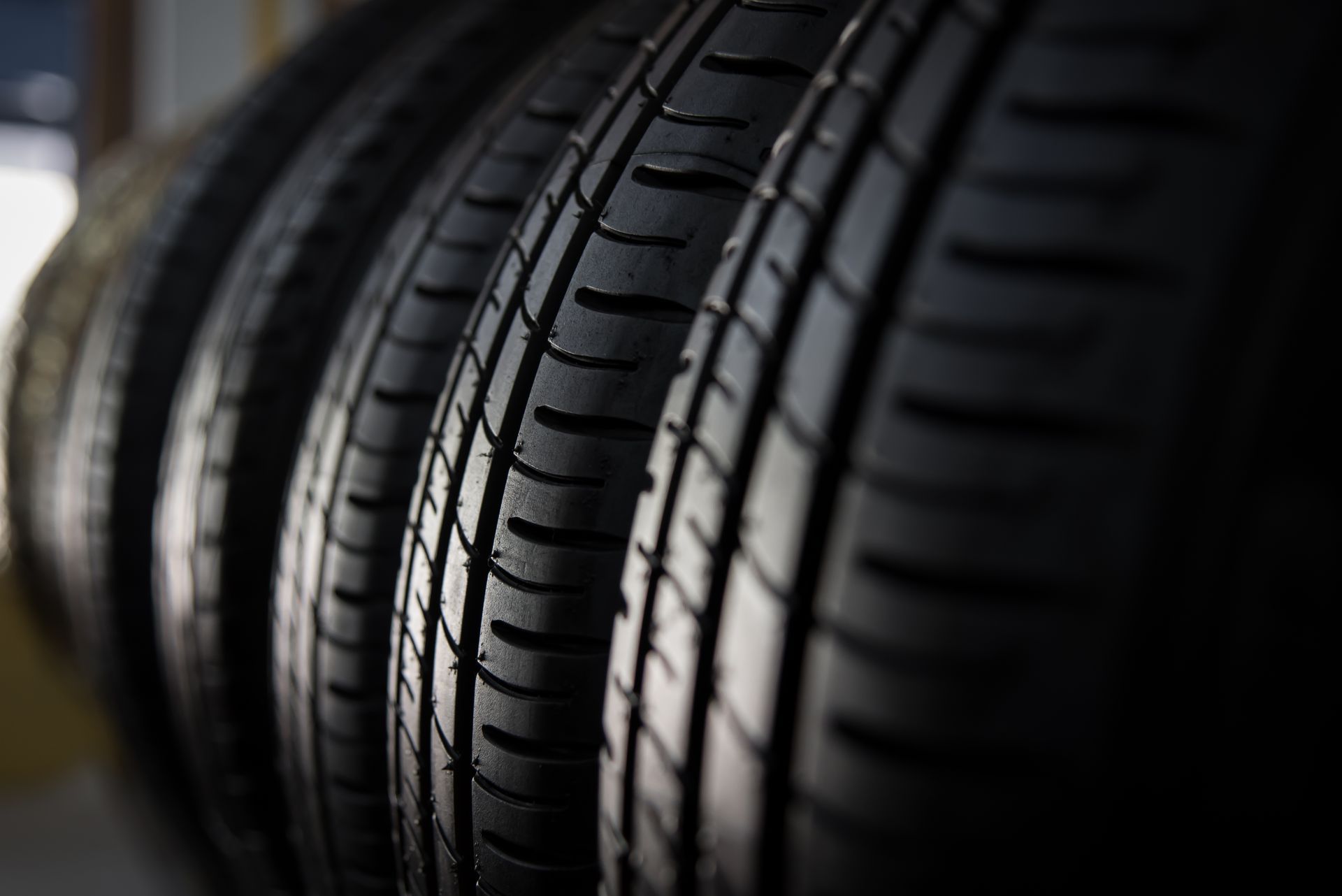 A close up of a row of tires stacked on top of each other.