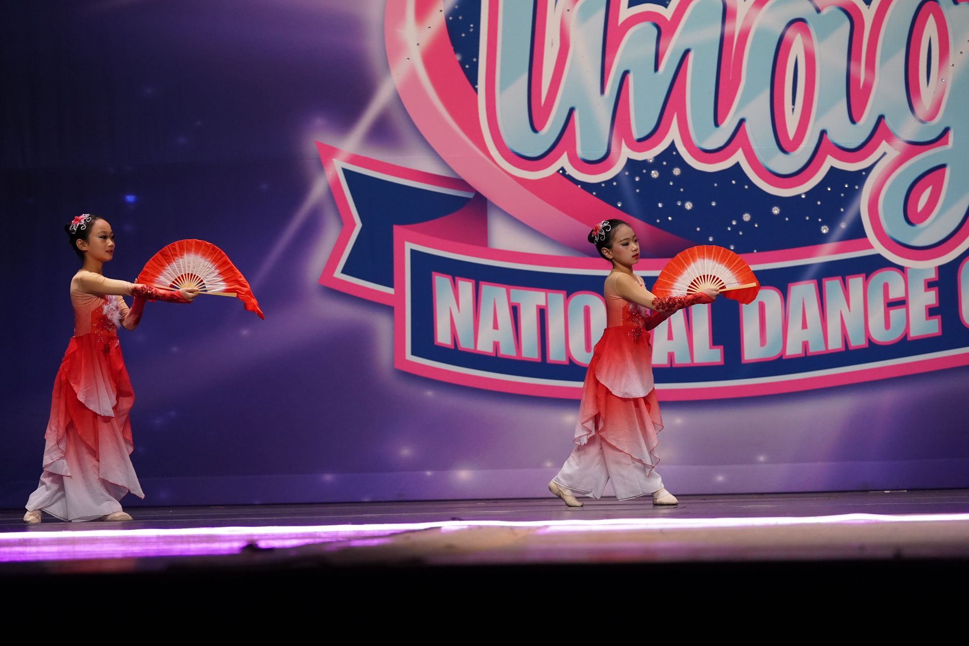 dancing blossoms pose with fan