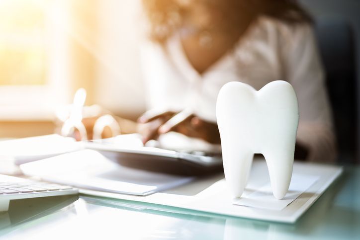 Oversized tooth model on a desk. 