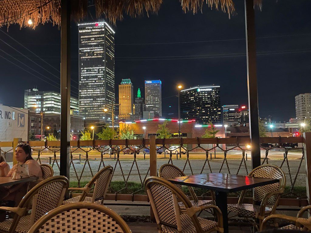 A restaurant with a view of a city at night