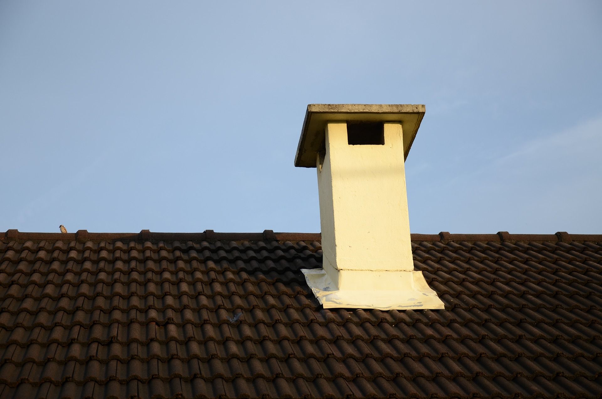 A Red Brick House With A No Parking Sign In Front Of It
