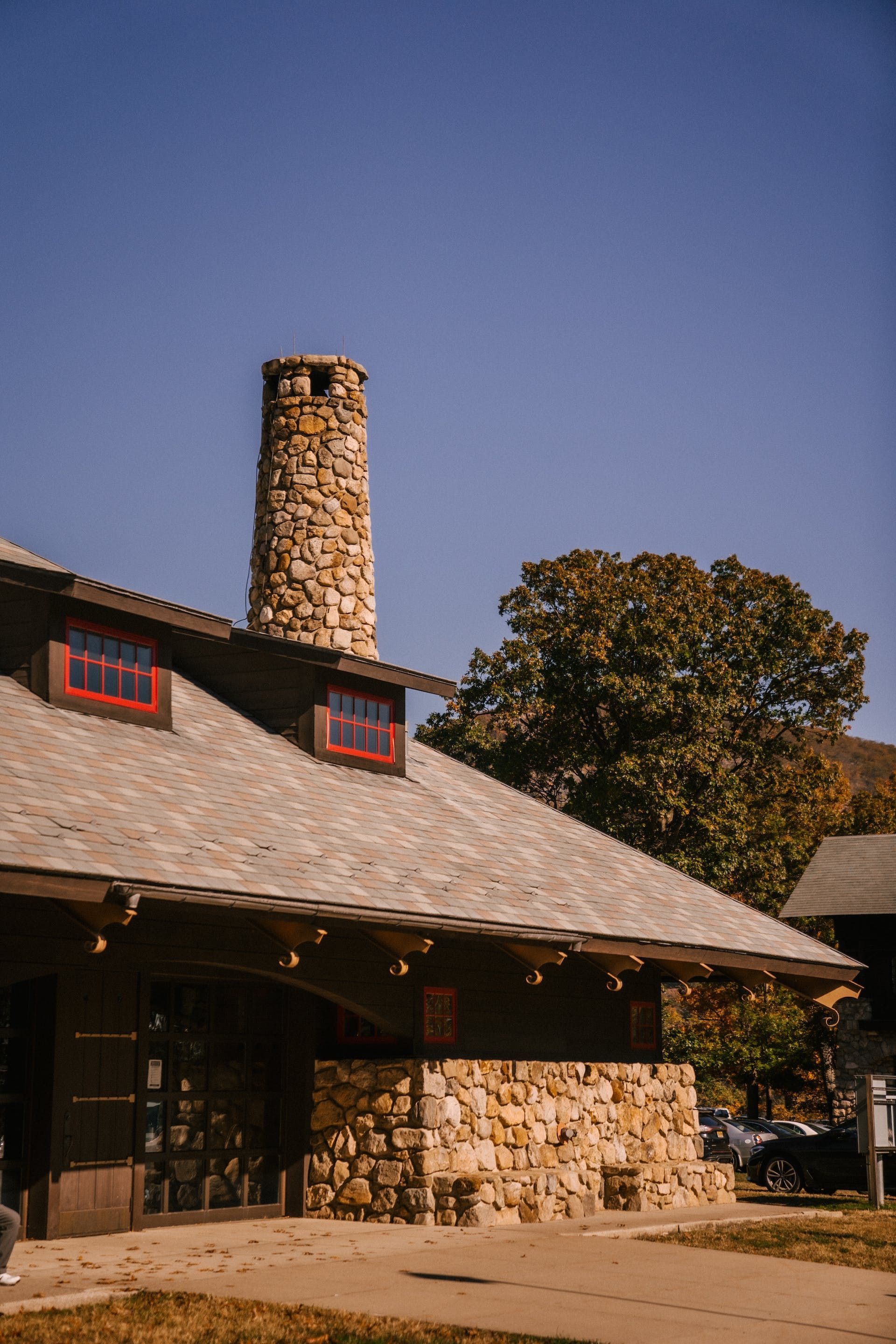 A Brick Building With A Triangle Shaped Roof