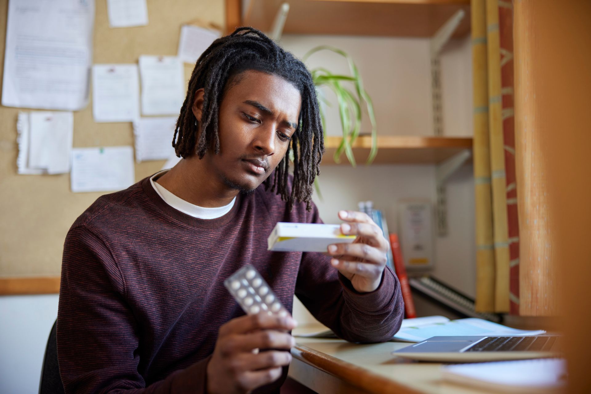 man checking medication