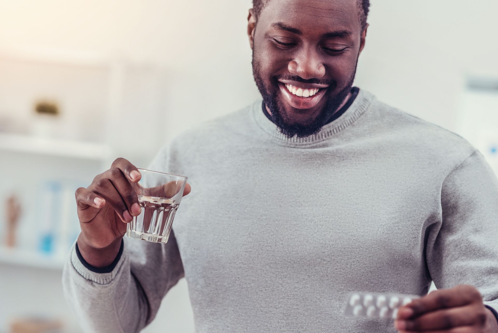 man taking his medication